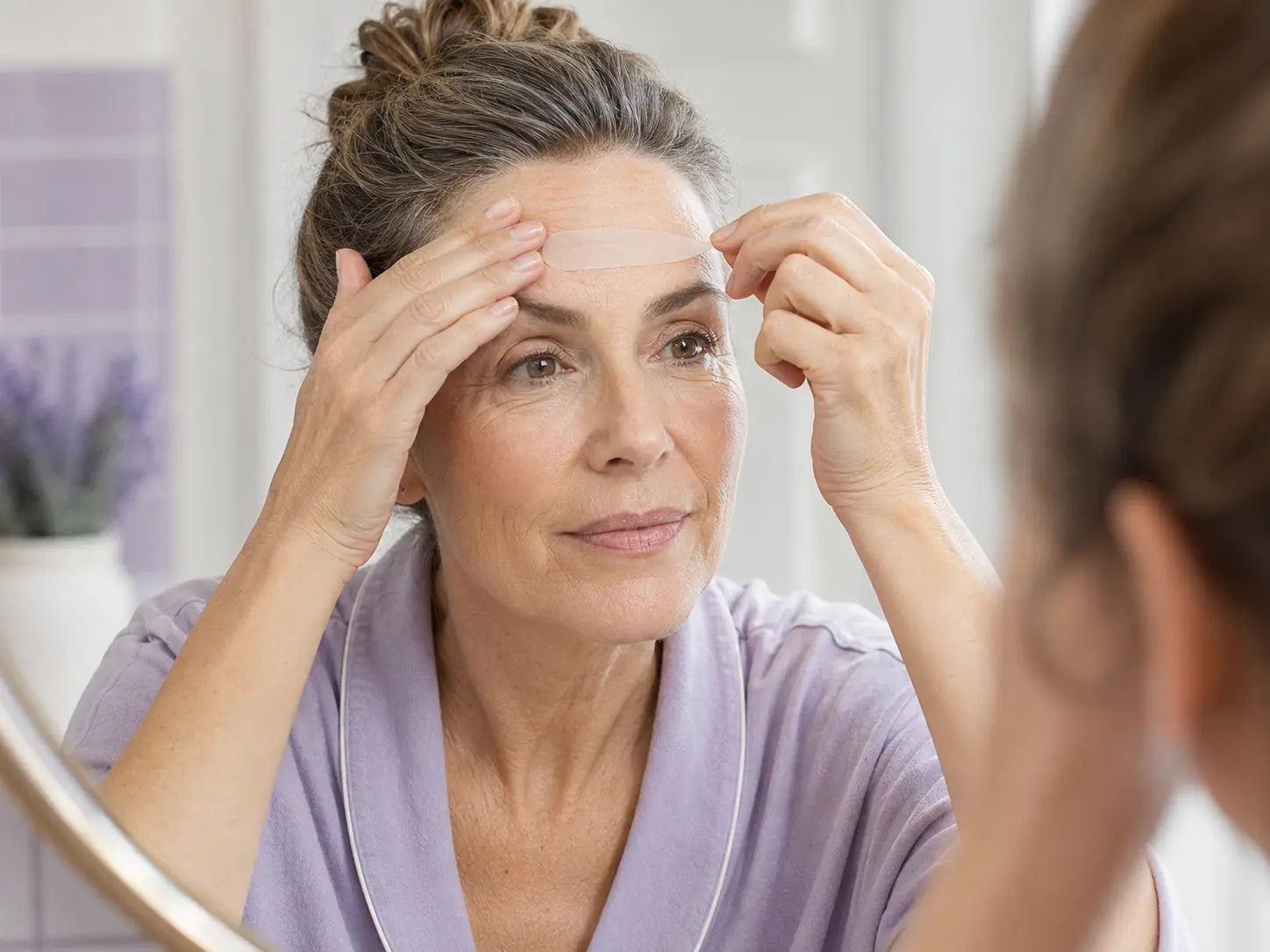 Applying FaceTape forehead patch