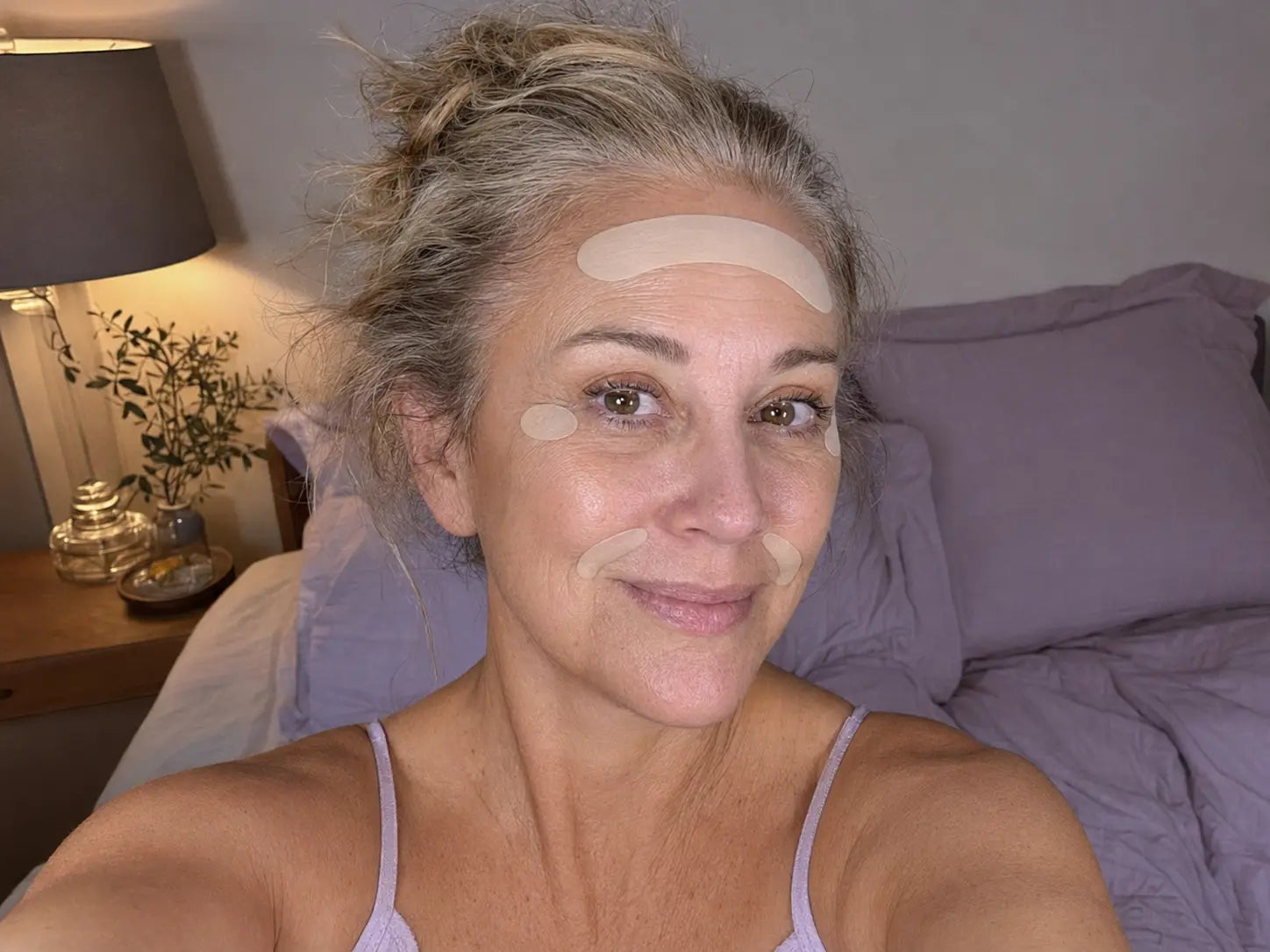 Woman wearing FaceTape pre-cut patches